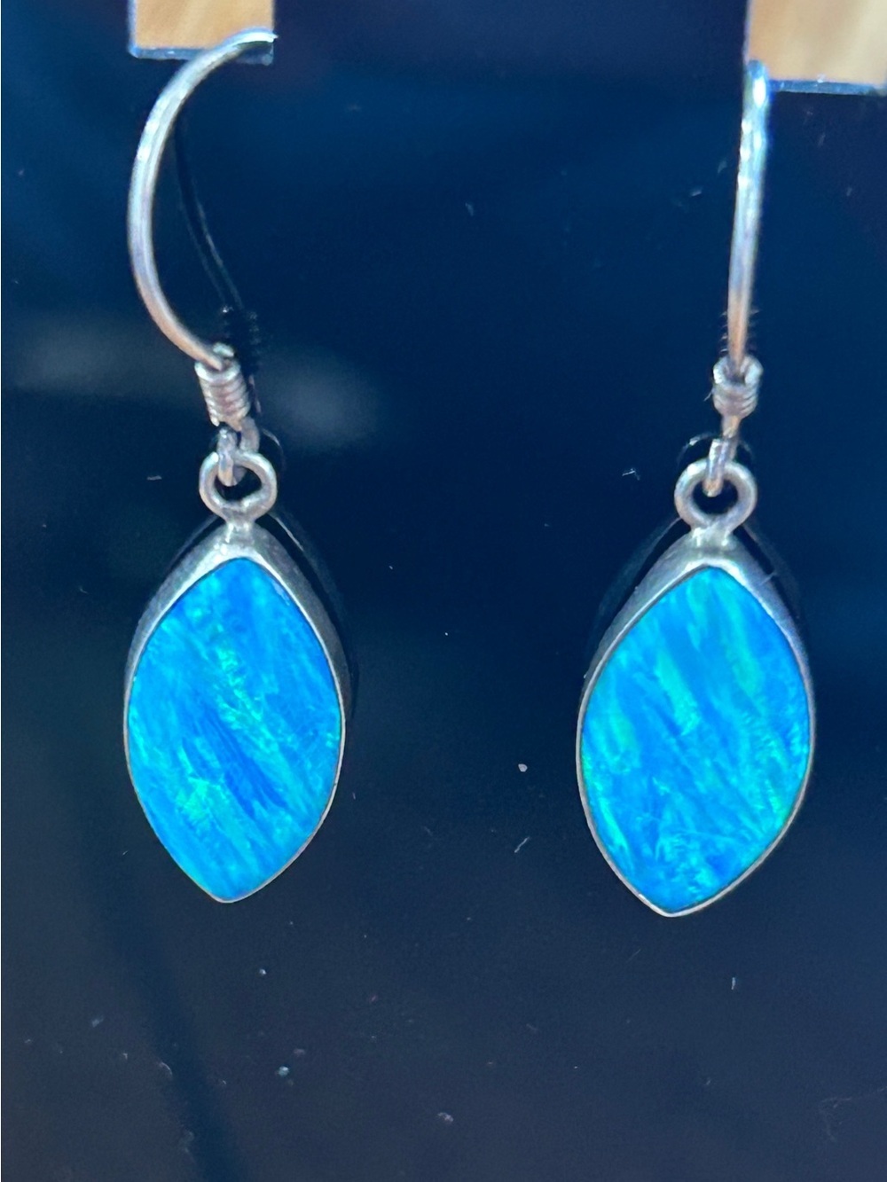 Blue lab grown opal and sterling marked earrings.